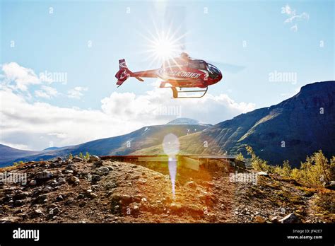 Helicopter In Mountains Stock Photo Alamy