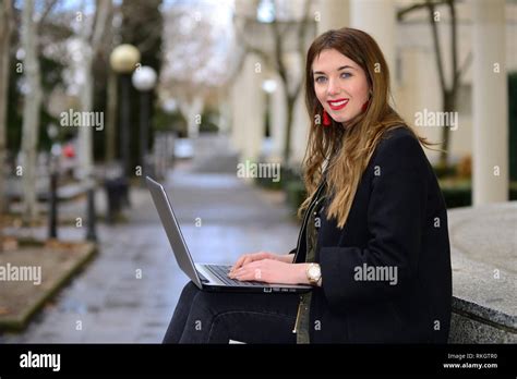 Woman With Computer Connected To The Internet Stock Photo Alamy