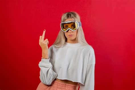 Premium Photo Woman Wearing Sunglasses Standing Against Red Background