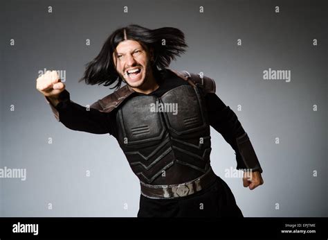 Angry Warrior Against Dark Background Stock Photo Alamy