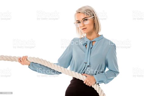 Beautiful Blonde Businesswoman In Glasses Pulling Rope Isolated On