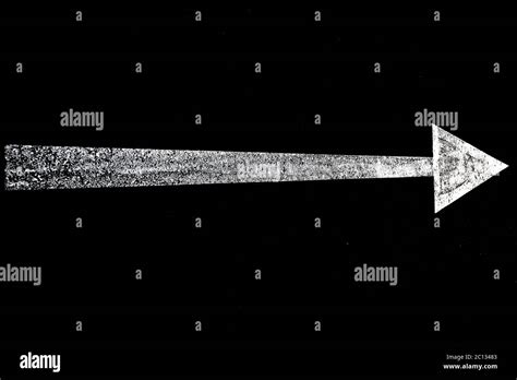 Long White Arrow On Black Background Image With High Contrast For