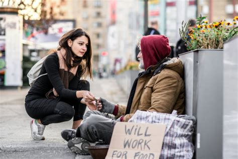 Person Giving Homeless Person Food