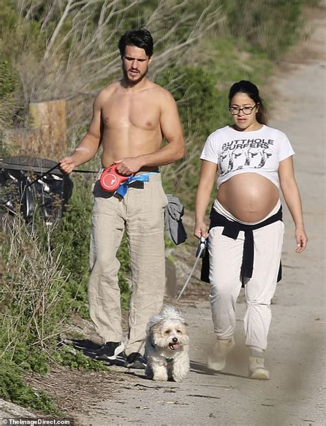 Still bumping along! Heavily pregnant Gina Rodriguez looks ready to pop on a dog walk with ...