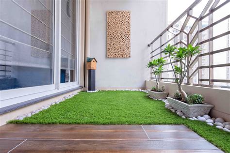 Compact Balcony Design With Turf Grass And Wooden Flooring 5x9 Ft