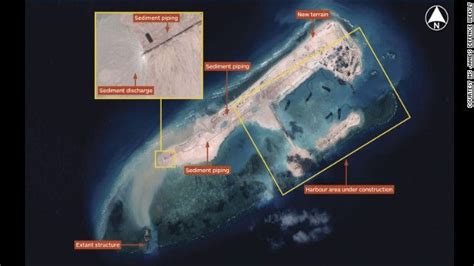 Report China Building Airstrip Capable Island In Disputed Waters