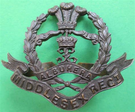 A Bronze Middlesex Regiment Cap Badge In Officers Bronze Cap Badges