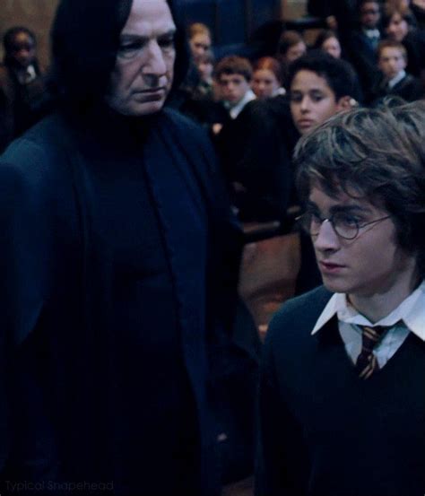 Two Harry Potters Are Standing Next To Each Other In Front Of A Large