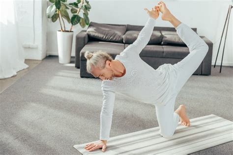 High Angle View Of Flexible Adult Man Yoga Exercise On Mat Stock Image