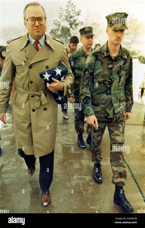 Us Charge D Affaires John Glassman Flanked By Us Marines Carries A