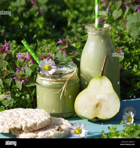 Green Smoothie With Edible Flowers And Fruits Hi Res Stock Photography