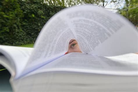 Girl Lying in Grass and Reading Book Stock Photo - Image of reading ...