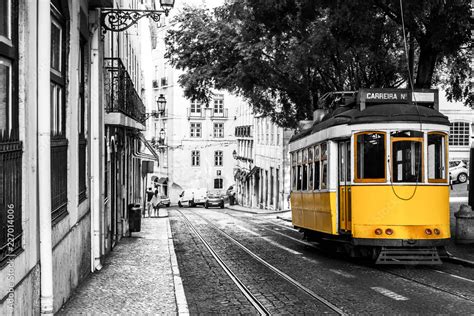 Yellow Tram On Old Streets Of Lisbon Portugal Popular Touristic