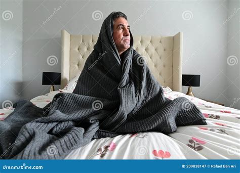 Afraid Adult Man Covered In Blanket Sitting On Bed Stock Image Image