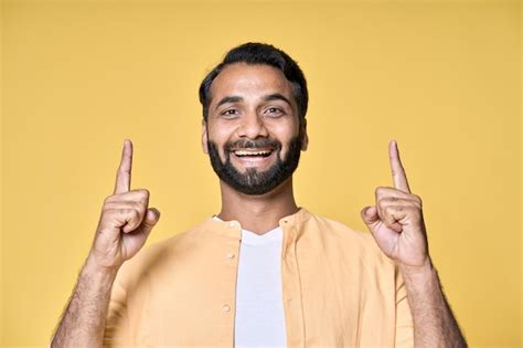 Premium Photo Smiling Indian Man Pointing Finger Up Advertising