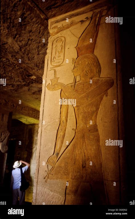 Tourist taking a picture of relief in the Abu Simbel temple. Egypt ...