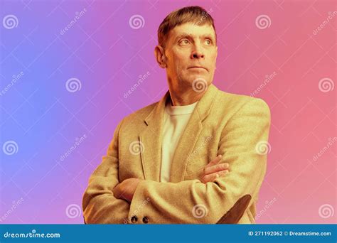 Portrait Of Mature Middle Aged Man In Jacket Posing With Serious Face