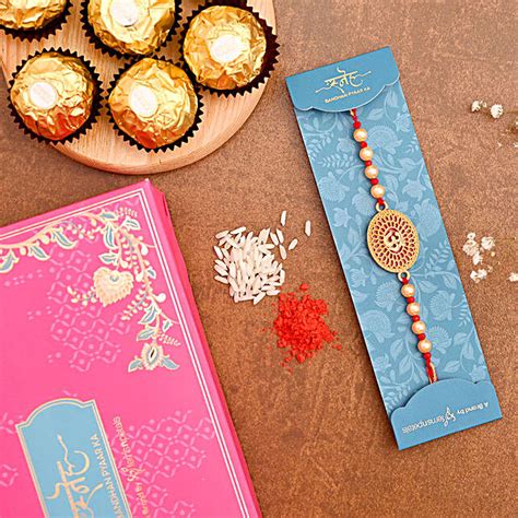 Spiritual Om Pearl Rakhi And 3 Pcs Ferrero Rocher Usa Gift Spiritual