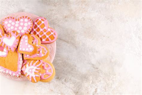 Plate With Homemade Glazed Decorated Heart Shaped Cookies For