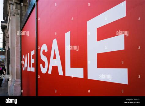 Sale Signs In A Store Window Uk Stock Photo Alamy