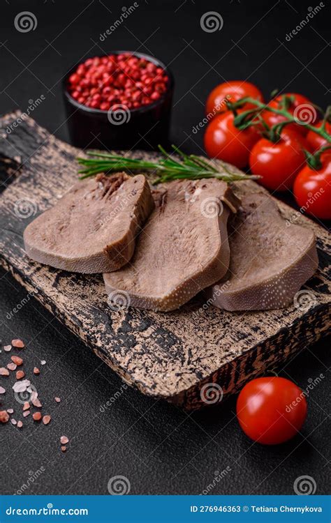 Delicious Boiled Beef Tongue Sliced With Vegetables And Spices Stock