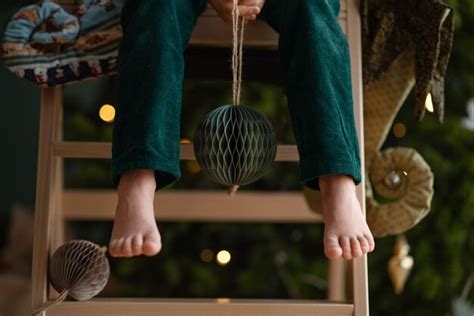 Premium Photo Barefoot Boy In An Elf Costume Holds Craft Paper Deep