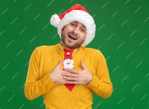 Free Photo Impressed Young Caucasian Man Wearing Christmas Hat And