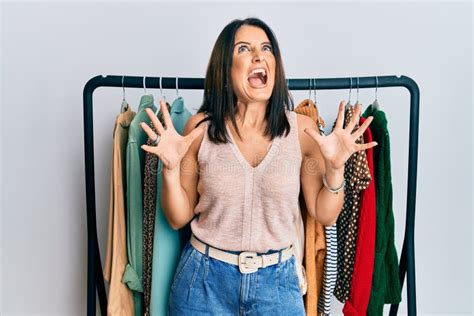 Middle Age Brunette Woman Working As Professional Personal Shopper