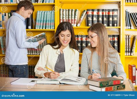 Friends Studying Together At Table In University Stock Image Image Of