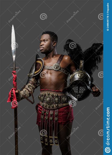 Naked African Gladiator With Plumed Helmet And Long Spear Stock Photo