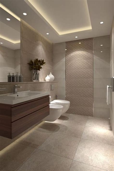 A Modern Bathroom With Two Sinks Toilet And Shower Stall In The Center