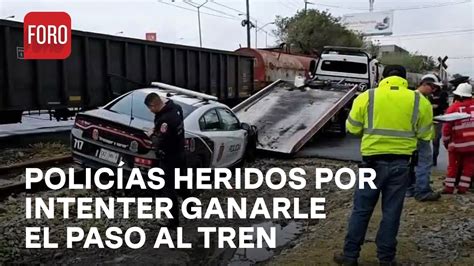 Policías resultan lesionados tras intentar ganarle el paso al tren en