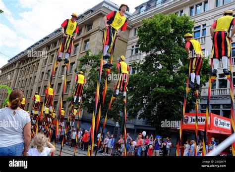 Stilt walkers in medieval style costume in the Belgian National Day parade.Brussels.Belgium ...