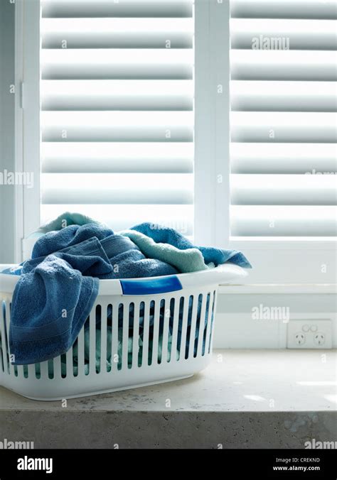 Towels In Laundry Basket Stock Photo Alamy