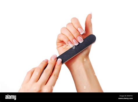 Woman Polishing Fingernails With The Nail File Stock Photo Alamy