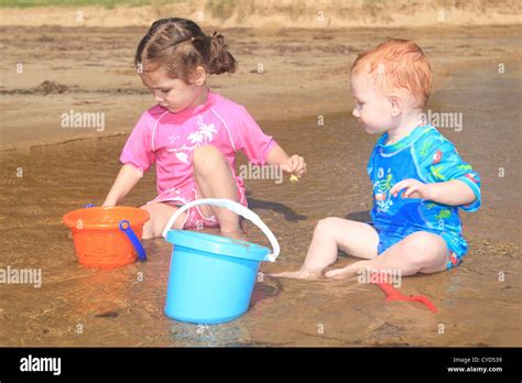 Children Playing With Bucket And Spades Hi Res Stock Photography And