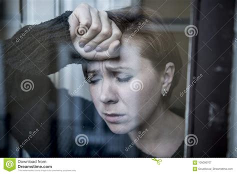 Dramatic Close Up Portrait Of Young Beautiful Woman Thinking And