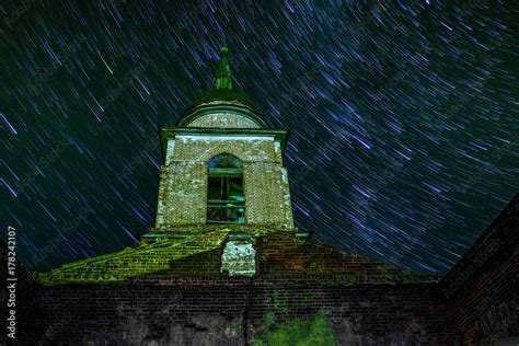 Old abandoned orthodox church under clear night sky with star trails, long exposure Stock Photo ...