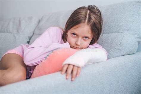 Close Up Of A Child`s Broken Arm In A Cast The Girl Put Her Broken Arm