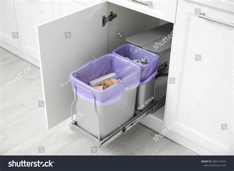 Open Cabinet Full Trash Bins Separate Shutterstock