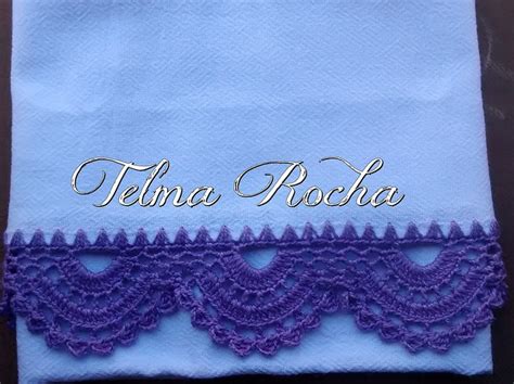 A Blue Towel With Purple Lace On It And The Name Telna Rocha Written In