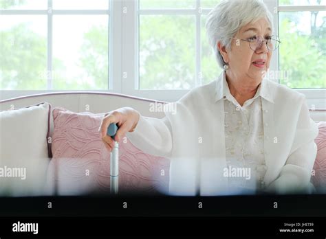 Retired Woman With Her Walking Stick Stock Photo Alamy