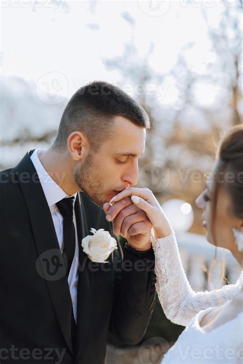 The Groom Kisses The Bride S Hand Wedding Photo Of A Couple In Love A