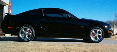 Black mustang, bullitt rims, red calipers - Ford Mustang Forum