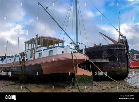 Boats Stranded By Low Tide On The River Orwell At Pin Mill Suffolk Uk