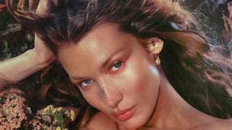 Bella Hadid Shows Off Her Incredible Figure In A Nude Mesh Floral Dress