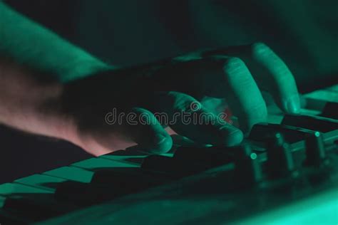 Hand Of Pianist Or Keyboardist Of A Rock Band Close Up Playing A