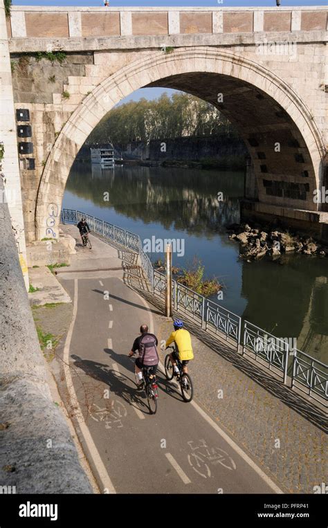 Italy Rome Trastevere Views Of Ponte Sisto And Cycling Beside The