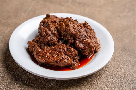 Premium Photo | Beef Rendang is a Minang dish originating from the ...