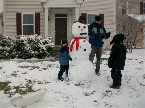 The Langel Family: Building a snowman